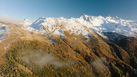 Autumn-Colors-In-Mont-Noble-With-Snow-capped-Mountains-Near-Mase-Village-in-Valais,-Switzerland