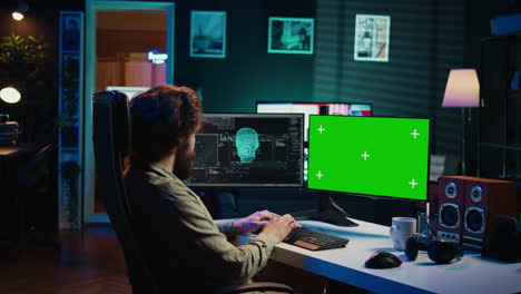 Man-communicating-with-artificial-intelligence-through-green-screen-computer