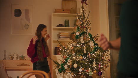 Man-connecting-plug-of-led-light-on-Christmas-tree