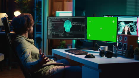 Man-communicating-with-artificial-intelligence-through-green-screen-computer