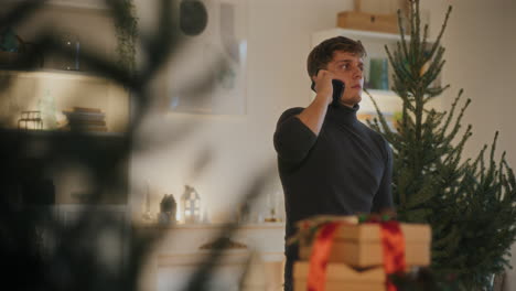 Man-trying-call-through-smart-phone-at-home