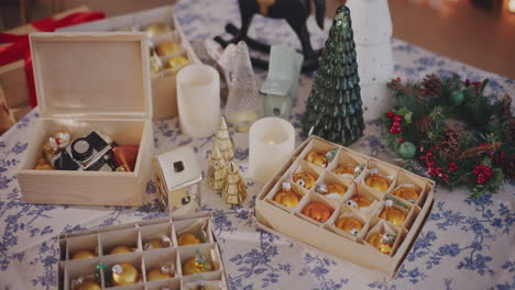 Baubles,-Xmas-tree-and-lighting-equipment-on-table