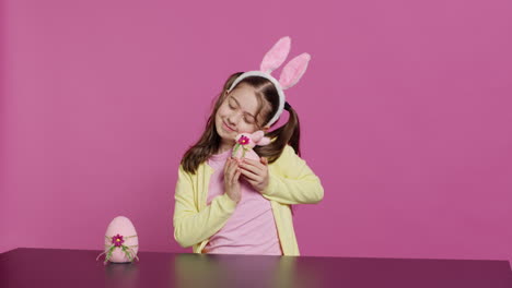 Delighted-little-girl-playing-around-with-lovely-easter-decorations