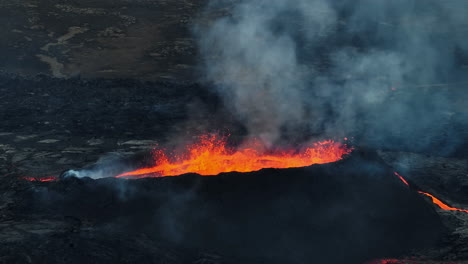 Erupted-volcano-and-surroundings,-boiling-lava-flowing,-pull-away-drone-shot