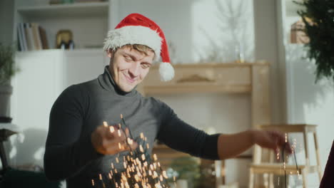 Man-wearing-Santa-cap-with-illuminated-lights