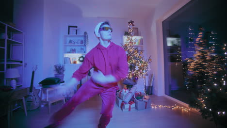 Man-performing-speedily-during-party-at-illuminated-home-during-Christmas
