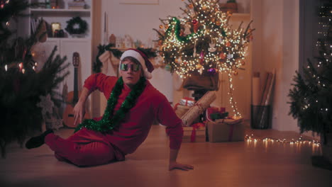 Man-performing-stunt-while-dancing-on-floor-during-Christmas