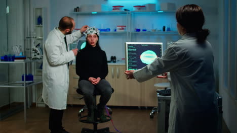 Man-doctor-examining-sensors-of-eeg-headset,-monitoring-brain-function