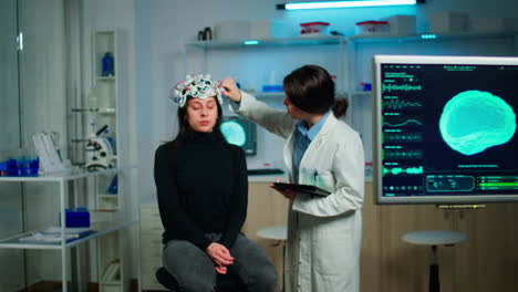 Doctor-analysing-brain-scan-using-tablet,-examining-evolution-of-disease