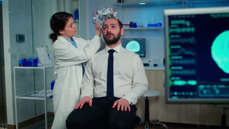 Medical-researcher-putting-performant-brainwave-scanning-headset