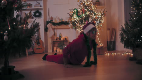 Excited-man-performing-stunt-while-dancing-on-floor-during-Christmas