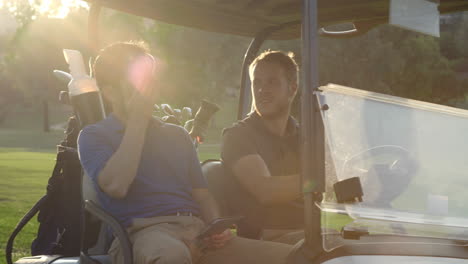 Golfers-Driving-Buggy-Along-Golf-Course-In-Slow-Motion