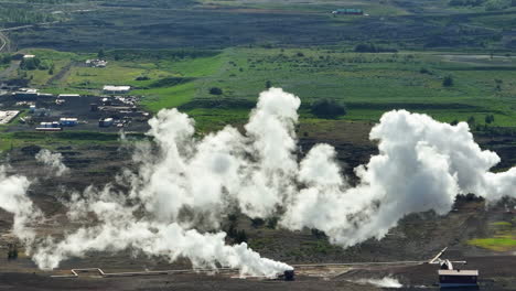 Geothermal-active-zone-with-the-steaming-ground,-geothermal-power-plant,-aerial