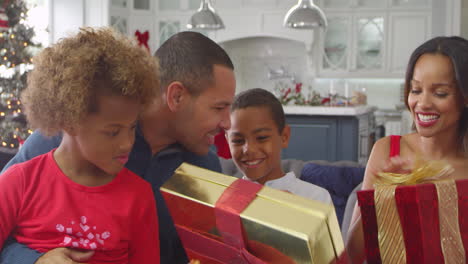 Children-Giving-Christmas-Presents-To-Parents-Shot-On-R3D