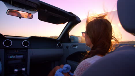 Female-Passenger-Driving-In-Convertible-Car-Shot-On-R3D