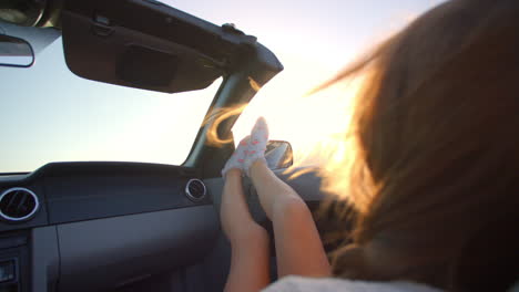 Female-Passenger-Relaxing-In-Convertible-Car-Shot-On-R3D