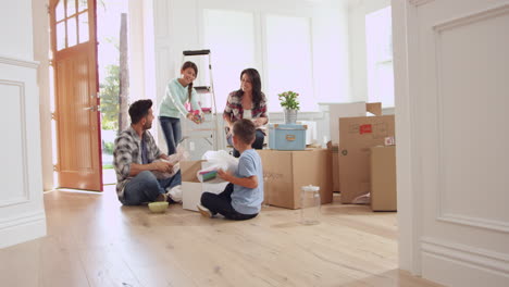 Hispanic-Family-Moving-Into-New-Home-Shot-On-R3D