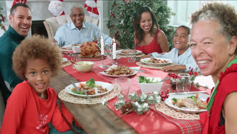 Slow-Motion-Shot-Of-Family-Enjoying-Christmas-Meal-At-Table