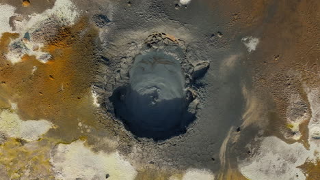 Bubbling-mud-pot-in-a-geothermal-area,-directly-above-view