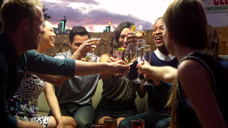 Friends-Enjoying-Night-Out-At-Rooftop-Bar-Shot-On-R3D