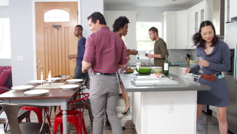 Group-of-friends-gather-for-dinner-in-a-kitchen,-shot-on-R3D
