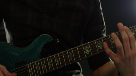 Close-Up-Of-Man-Playing-Electric-Guitar-Shot-On-R3D