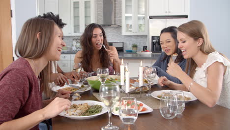Female-friends-talking-at-a-dinner-table,-shot-on-R3D