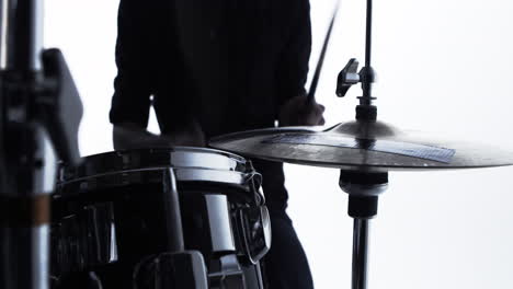 Close-Up-Of-Drummer-Playing-Drum-Kit-In-Studio-Shot-On-R3D