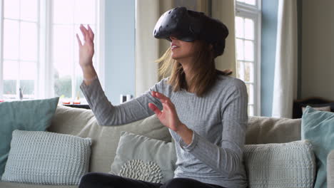 Woman-At-Home-Wearing-Virtual-Reality-Headset-Shot-On-R3D