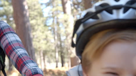 Close-up-shot-of-family-on-bikes-in-a-forest