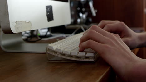 Close-Up-Of-Teenage-Boy-Typing-On-Computer-Keyboard-On-R3D