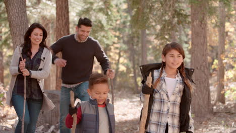 Hispanic-family-hiking-in-forest-walk-out-of-shot-right-side