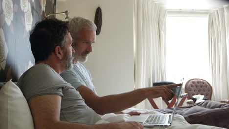 Gay-Couple-Researching-On-Laptop-In-Hotel-Room-Shot-On-R3D