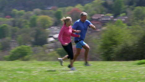 Mature-Couple-Jogging-In-Countryside-Shot-On-R3D