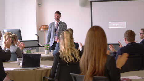 Delegates-Applaud-Businessman-After-Presentation-Shot-On-R3D