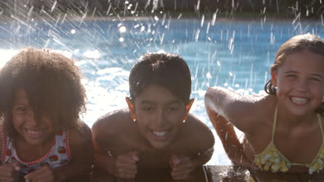 Portrait-Of-Children-Having-Fun-In-Outdoor-Swimming-Pool