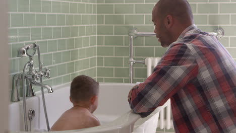Father-And-Son-Having-Fun-At-Bath-Time-Together