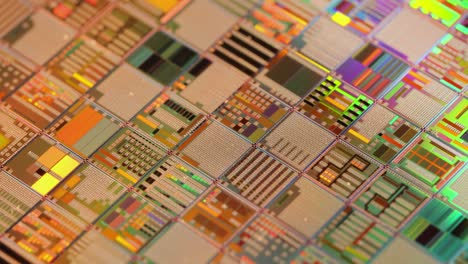 Silicon-semiconductor-wafer-close-up.-In-electronics,-a-wafer-also-called-a-slice-or-substrate-is-a-thin-slice-of-semiconductor,-a-crystalline-silicon,-used-for-the-fabrication-of-integrated-circuits