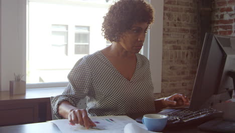 Mature-Businesswoman-Works-On-Computer-In-Office-Shot-On-R3D