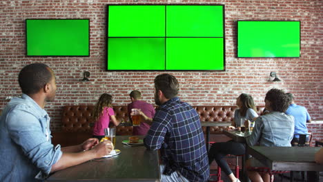 Friends-Watching-Game-In-Sports-Bar-On-Screens-Shot-On-R3D