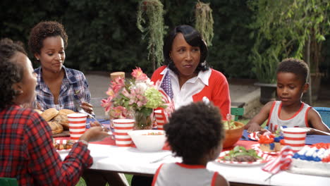 Women-and-children-talking-at-4th-July-family-barbecue