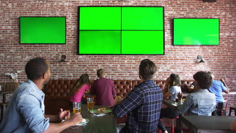 Friends-Watching-Game-In-Sports-Bar-On-Screens-Shot-On-R3D