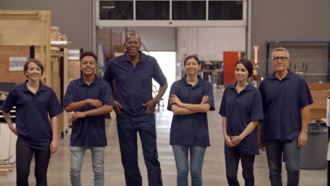 Engineers-And-Apprentices-Walk-Towards-Camera-In-Factory