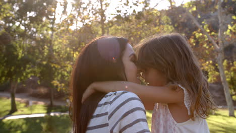 Slow-Motion-Sequence-Of-Mother-Hugging-Daughter-In-Park