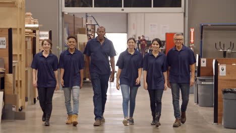Engineers-And-Apprentices-Walk-Towards-Camera-In-Factory