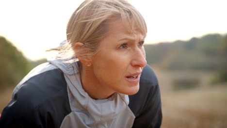 Mature-Female-Runner-Resting-During-Exercise-In-Slow-Motion