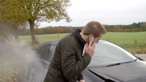 Man-Calling-To-Report-Car-Accident-On-Country-Road