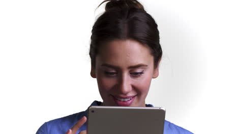 Shot-Of-Woman-Using-Digital-Tablet-Against-White-Background