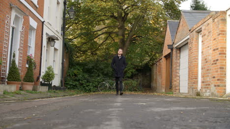 Slow-Motion-Shot-Of-Man-Walking-Along-Street-In-Oxford