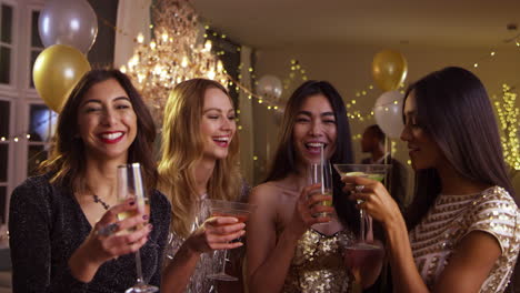 Female-Friends-Make-Toast-As-They-Celebrate-At-Party